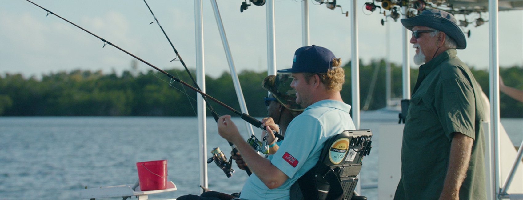 Men in motorized chairs fishing