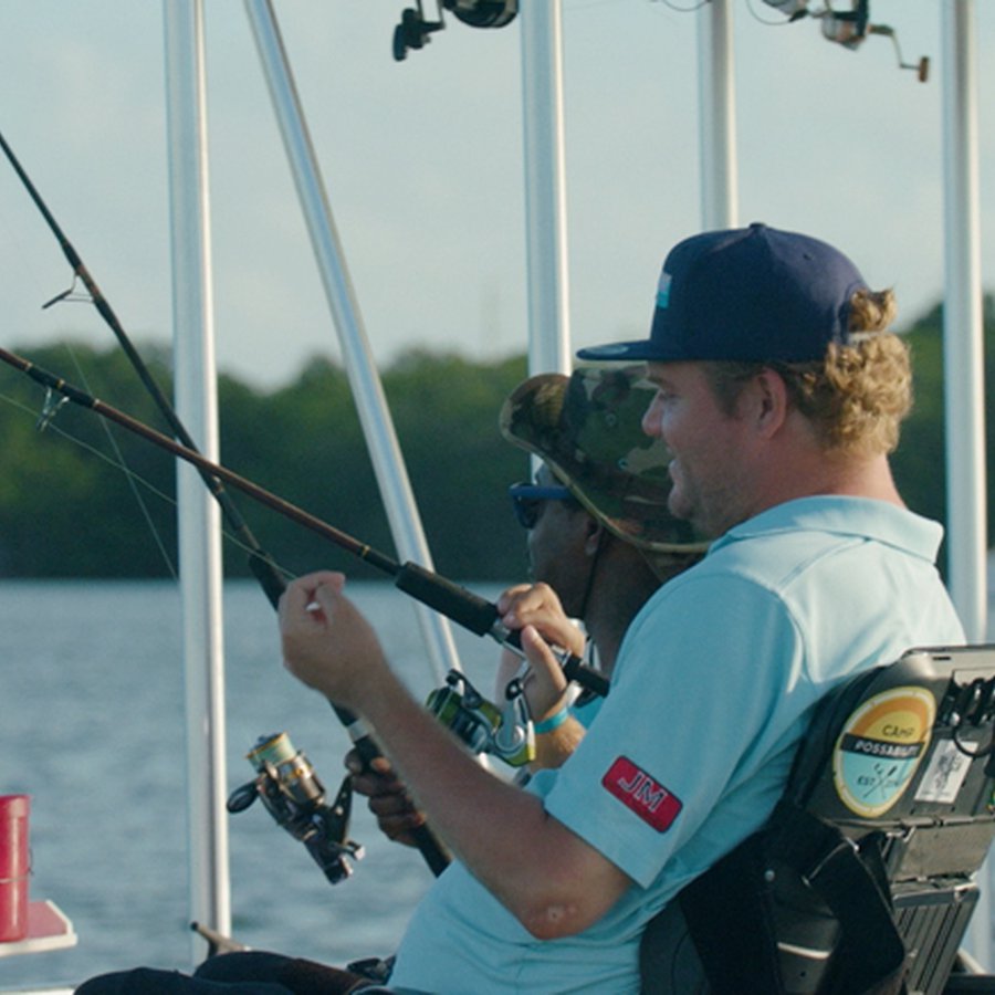 Men in motorized chairs fishing